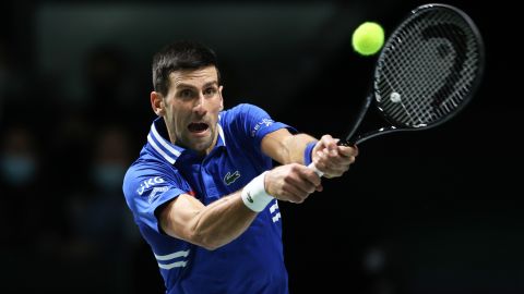 Djokovic, pictured playing a shot during the Davis Cup in Madrid last month, is hoping to win his 10th title at the Australian Open. 