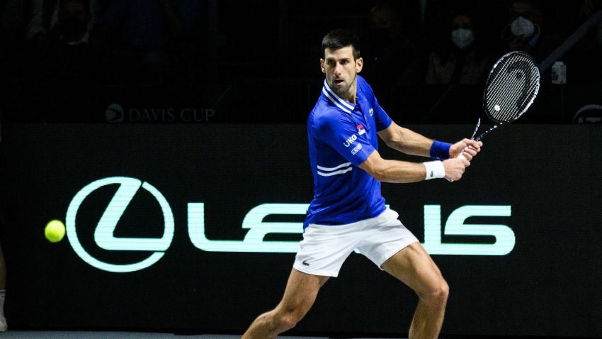 MADRID, SPAIN - DECEMBER 03: (EDITORIAL USE ONLY) Novak Djokovic of Serbia plays a backhand against Marin Cilic of Croatia during the Davis Cup Semi Final match between Croatia and Serbia at Madrid Arena pavilion on December 03, 2021 in Madrid, Spain. (Photo by Juan Naharro Gimenez/Getty Images for Lexus)