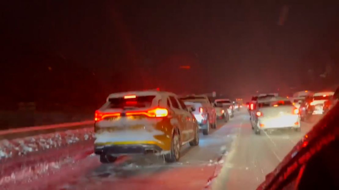 Cars stuck on the interstate as travelers wait for traffic to clear. 