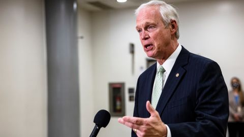 Sen. Ron Johnson answers questions from reporters in the Senate subway at the US Capitol on February 12, 2021, in Washington. 
