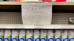 A handwritten notice is posted on an empty shelf after at-home COVID-19 test kits were sold out at a CVS store in La Habra, Calif., Tuesday, Dec. 28, 2021. (AP Photo/Jae C. Hong)