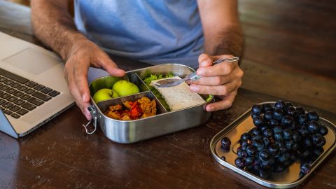 If you struggle with mindless snacking, taking a daily break for a proper lunch and keeping filling, fiber-rich fruit on hand are two ways to help avoid going overboard.