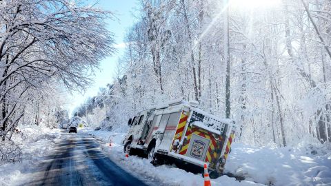 A fire engine rests on the side of the road after sliding off during icy conditions in Stafford County, Virginia