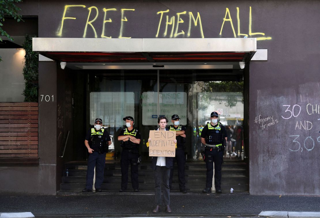 Police stand guard at the government detention center.