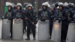 Riot police officers stand by during a protest in Almaty, Kazakhstan, Wednesday, Jan. 5, 2022. Demonstrators denouncing the doubling of prices for liquefied gas have clashed with police in Kazakhstan's largest city and held protests in about a dozen other cities in the country. (AP Photo/Vladimir Tretyakov)