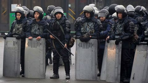 Riot police officers stand by during a protest in Almaty, Kazakhstan, on January 5, 2022.