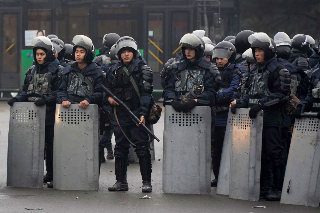 Riot police officers stand by during a protest in Almaty, Kazakhstan, on January 5, 2022.