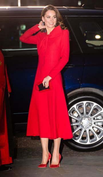 For the 2021 royal Christmas carol service in Westminster Abbey, the duchess stepped out in a cherry-red Catherine Walker coat dress -- complete with an oversized festive bow.
