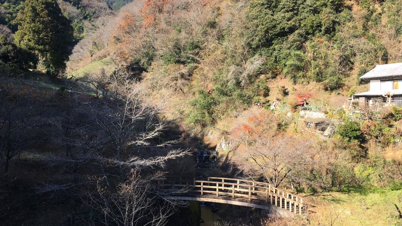 <strong>The view: </strong>The property is overlooked by Kikuchi's own tea plant-covered hillside and separated from a few neighbors by a picturesque stream and bridge. 
