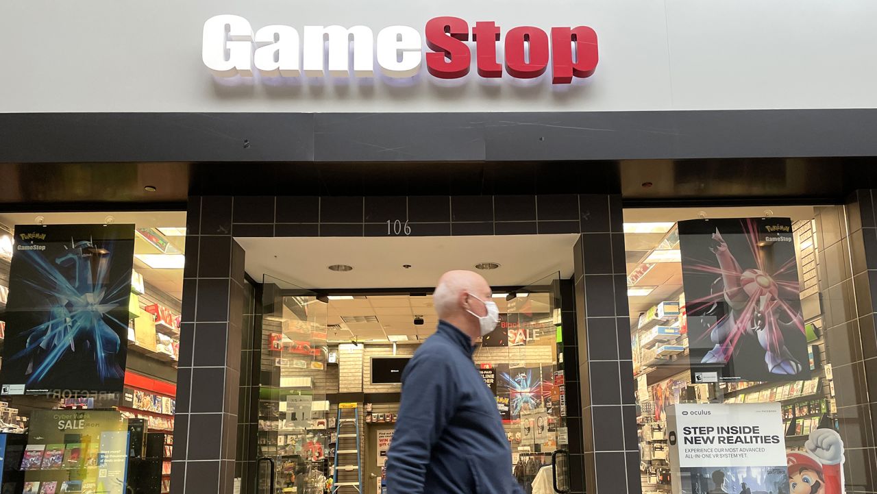 A mall visitor walks be a GameStop store on December 08, 2021 in San Rafael, California.