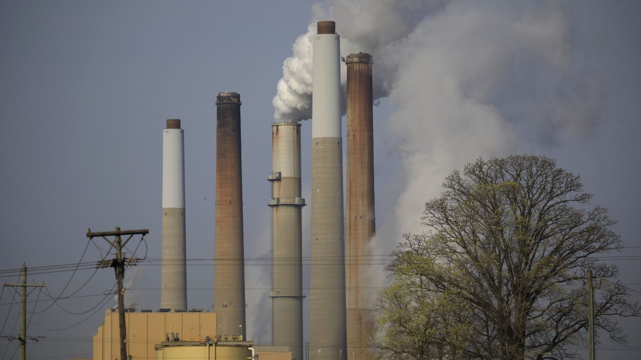 Smoke and steam rises from a coal-fired power plant in Kentucky in 2021. Greenhouse gas emissions from coal increased in 2021 for the first time in seven years, according to Rhodium Group.