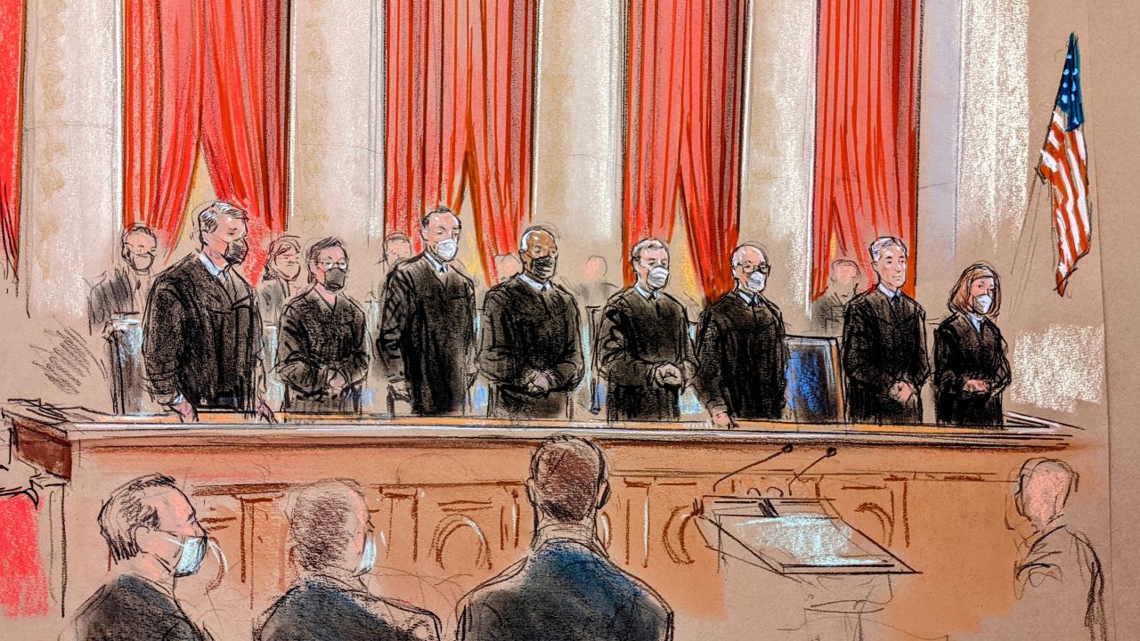 Supreme Court justices at oral arguments on January 7. Justice Neil Gorsuch is unmasked. Justice Sonia Sotomayor participated remotely. 