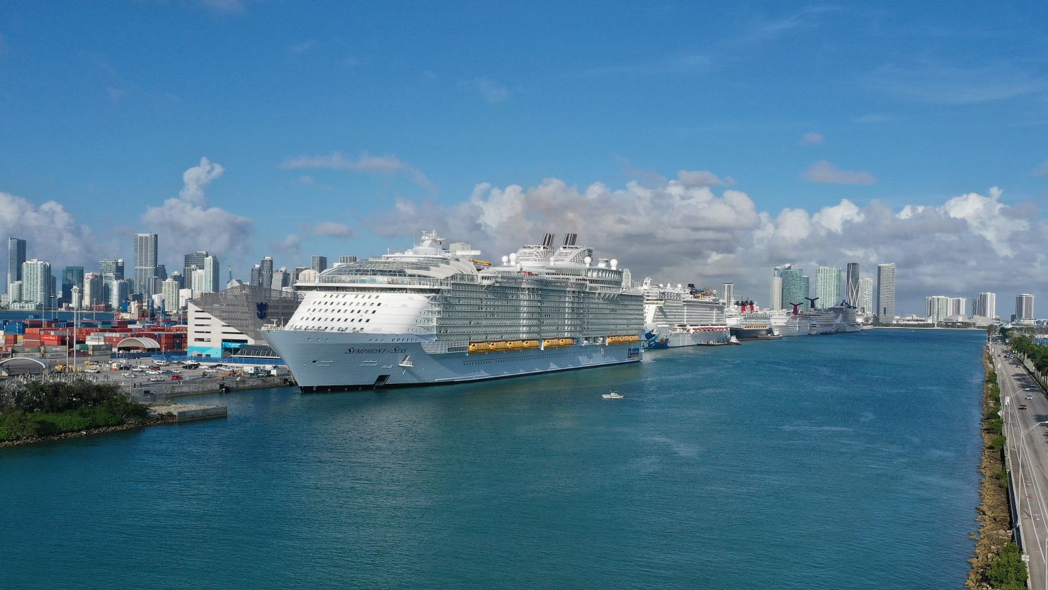 MIAMI, FLORIDA - MARCH 14: An aerial view from a drone shows the Royal Caribbean Symphony of the Seas Cruise ship which is the world's largest passenger liner docked at PortMiami after returning to port from a Eastern Caribbean cruise as the world deals with the coronavirus outbreak on March 14, 2020 in Miami, Florida. U.S. President Donald Trump tweeted yesterday that at his request Carnival, Royal Caribbean, Norwegian, and MSC have all agreed to suspend outbound cruises as the world tries to contain the COVID-19 outbreak. (Photo by Joe Raedle/Getty Images)