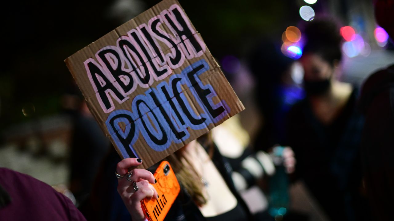 A placard displayed during a protest march on April 12, 2021, in Philadelphia states "ABOLISH POLICE."