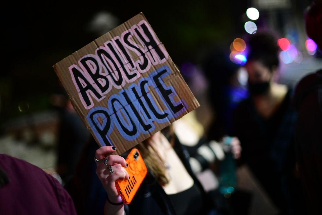 A placard displayed during a protest march on April 12, 2021, in Philadelphia states "ABOLISH POLICE."