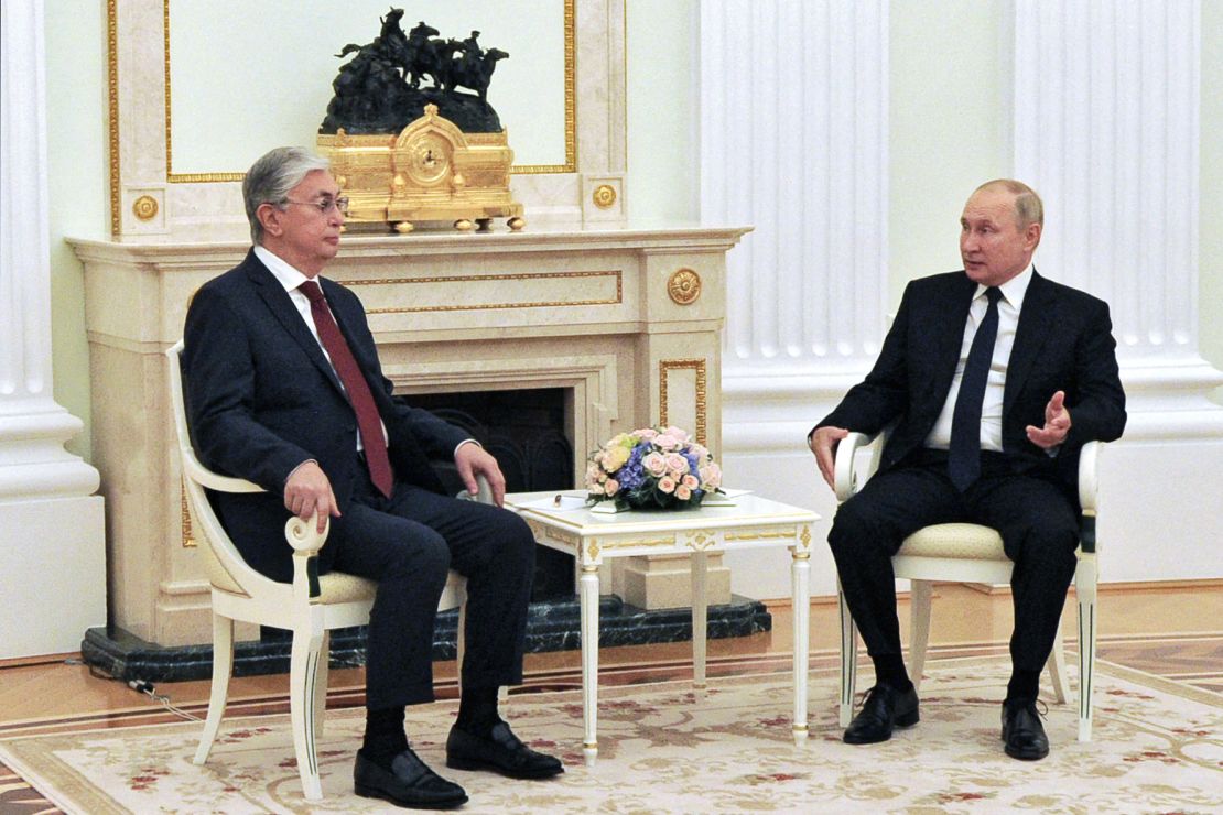 Russia's President Vladimir Putin speaks with Kazakhstan's President Kassym-Jomart Tokayev during their meeting in Moscow on August 21, 2021. 