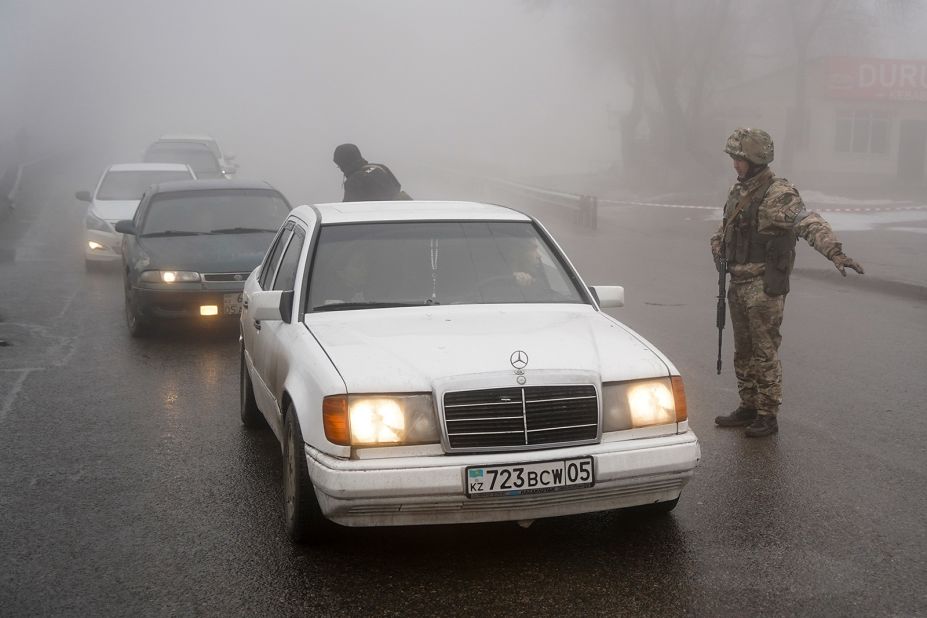 Soldiers control a road in Almaty on January 8.