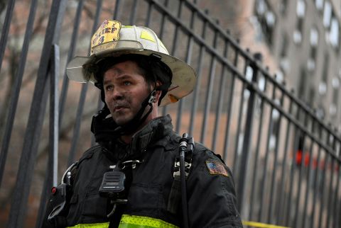 Emergency personnel from the FDNY respond to an apartment building fire in the Bronx borough of New York City.