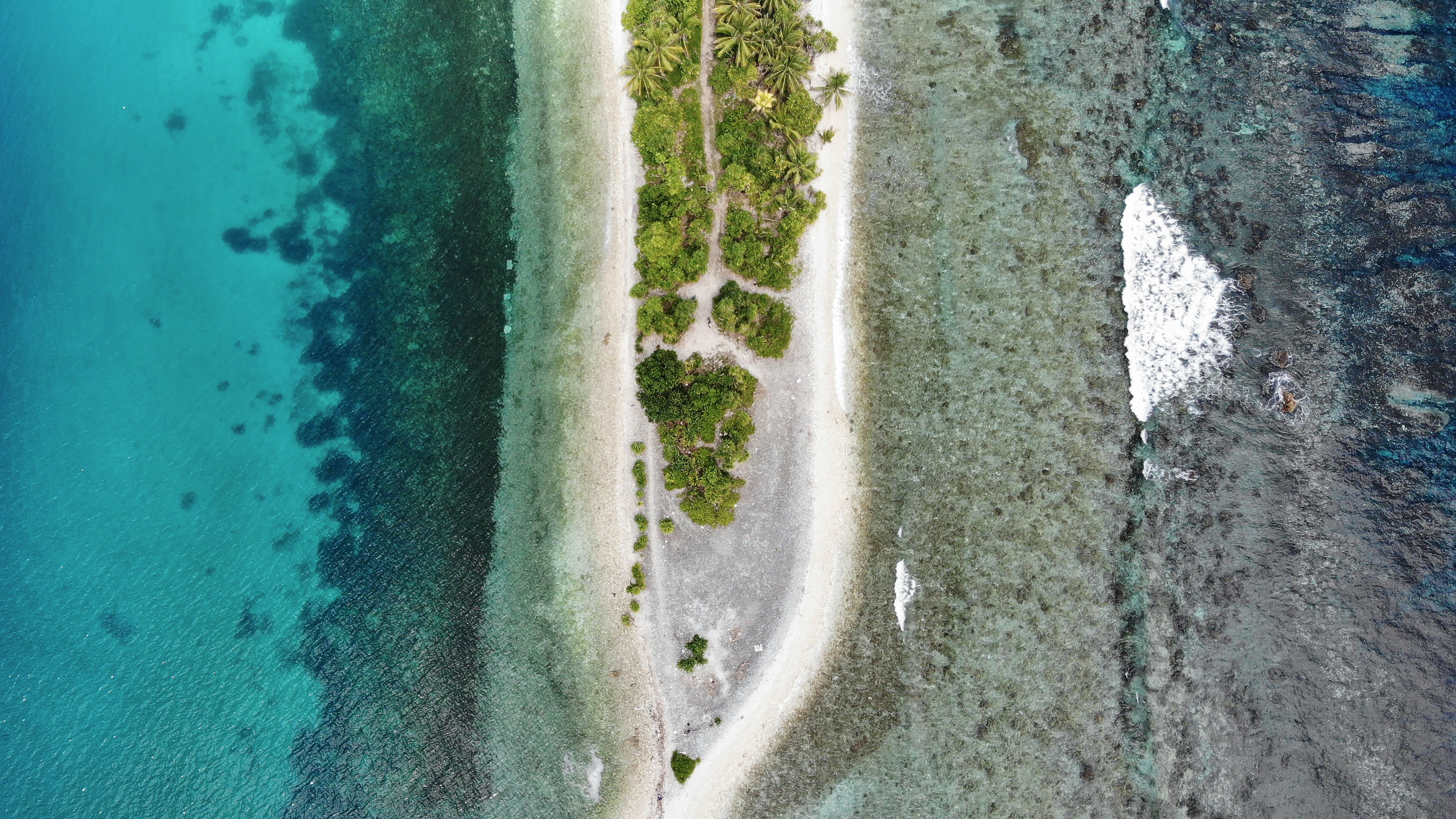An aerial view of the southern tip of Fongafale island in Tuvalu. The low-lying South Pacific island nation is particularly vulnerable to sea level rise, which is caused in part by warming ocean temperatures. 