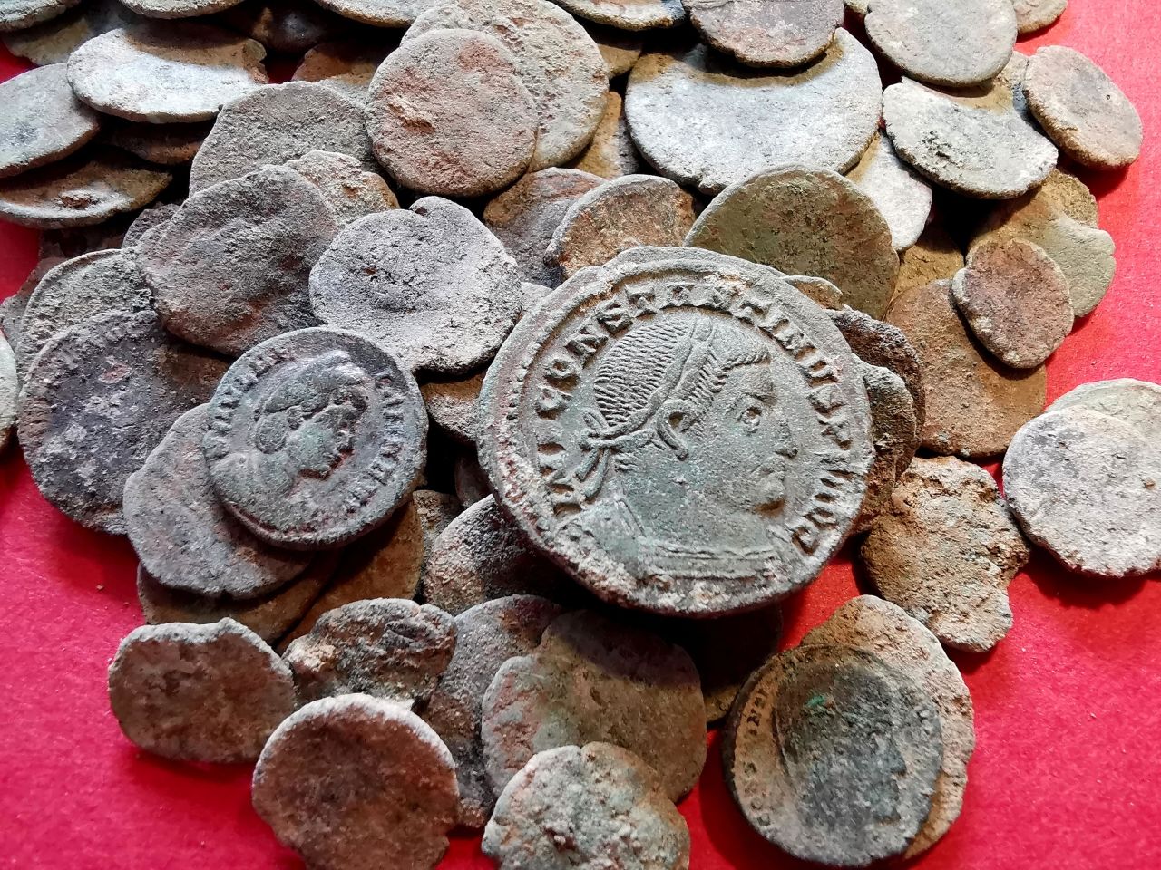 The coins were probably hidden by people fleeing barbarians, archaeologists say.