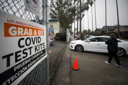 Los Angeles Unified School District staff distribute free Covid-19 test kits to local families on Friday, January 7, ahead of this week's return to school.