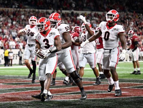 Georgia running back Zamir White celebrates with his teammates after scoring on a 1-yard touchdown run late in the third quarter. After the extra point, Georgia led 13-9.