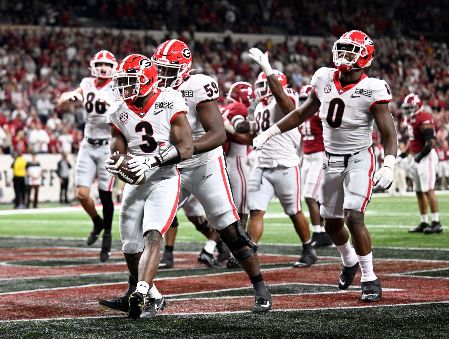 Georgia running back Zamir White celebrates with his teammates after scoring on a 1-yard touchdown run late in the third quarter. After the extra point, Georgia led 13-9.