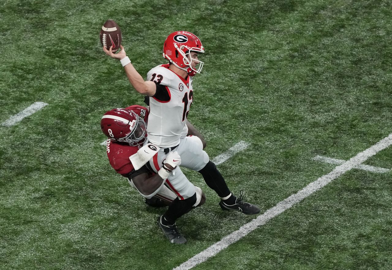 Bennett fumbles the ball as he is hit by Alabama linebacker Christian Harris in the fourth quarter. Alabama recovered deep in Georgia territory and went on to score a touchdown.