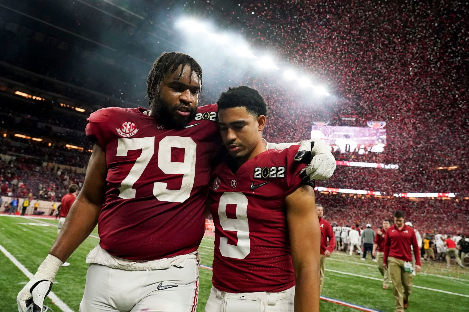 Alabama offensive lineman Chris Owens, left, and quarterback Bryce Young leave the field after the game.