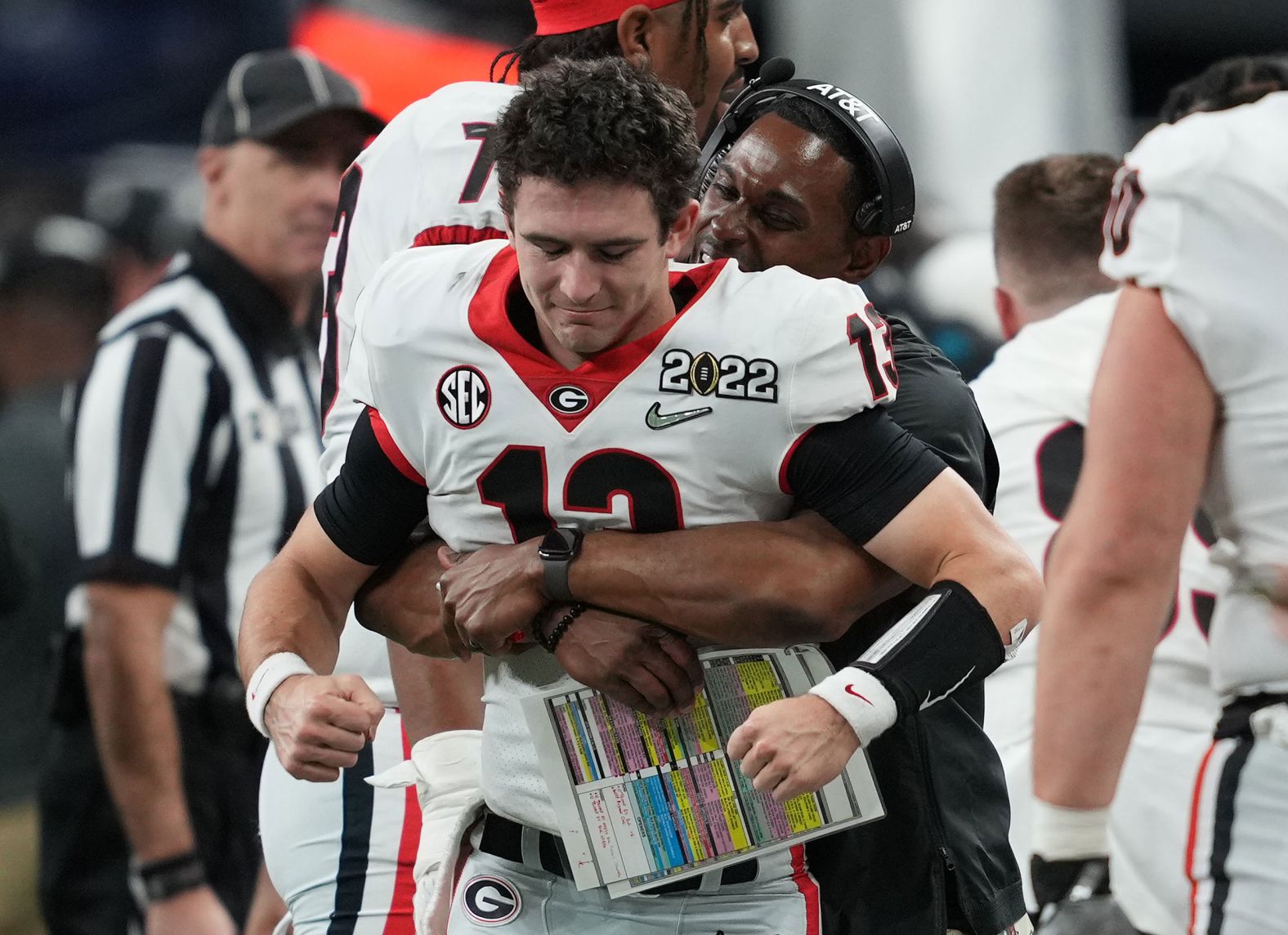 Bennett is hugged by a Bulldogs assistant coach late in the game.