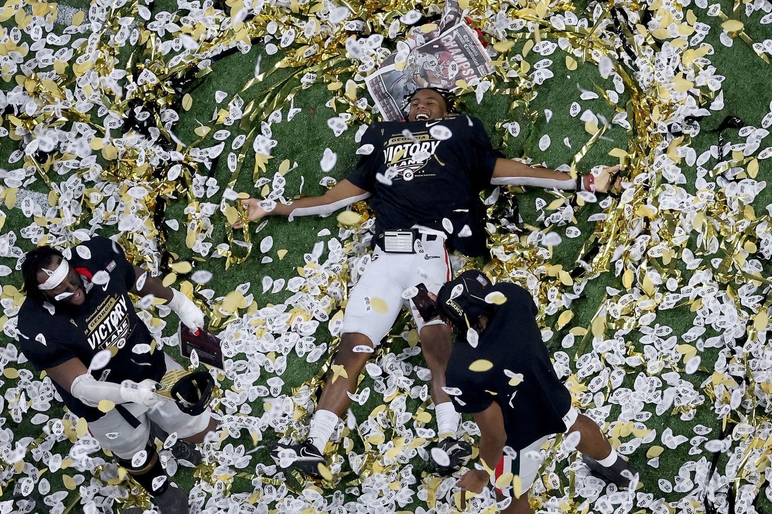 Georgia players celebrate in the confetti.