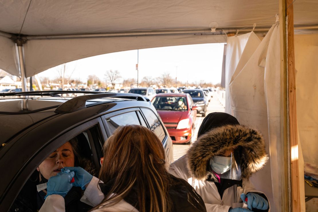 A technician administers a Covid-19 test Monday at a drive-thru location at Churchill Downs, Kentucky.