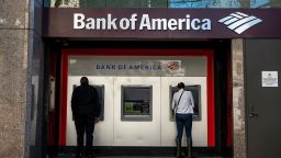 People use automated teller machines (ATM) outside a Bank of America branch in San Francisco, California, U.S., on Thursday, Jan. 14, 2021. 
