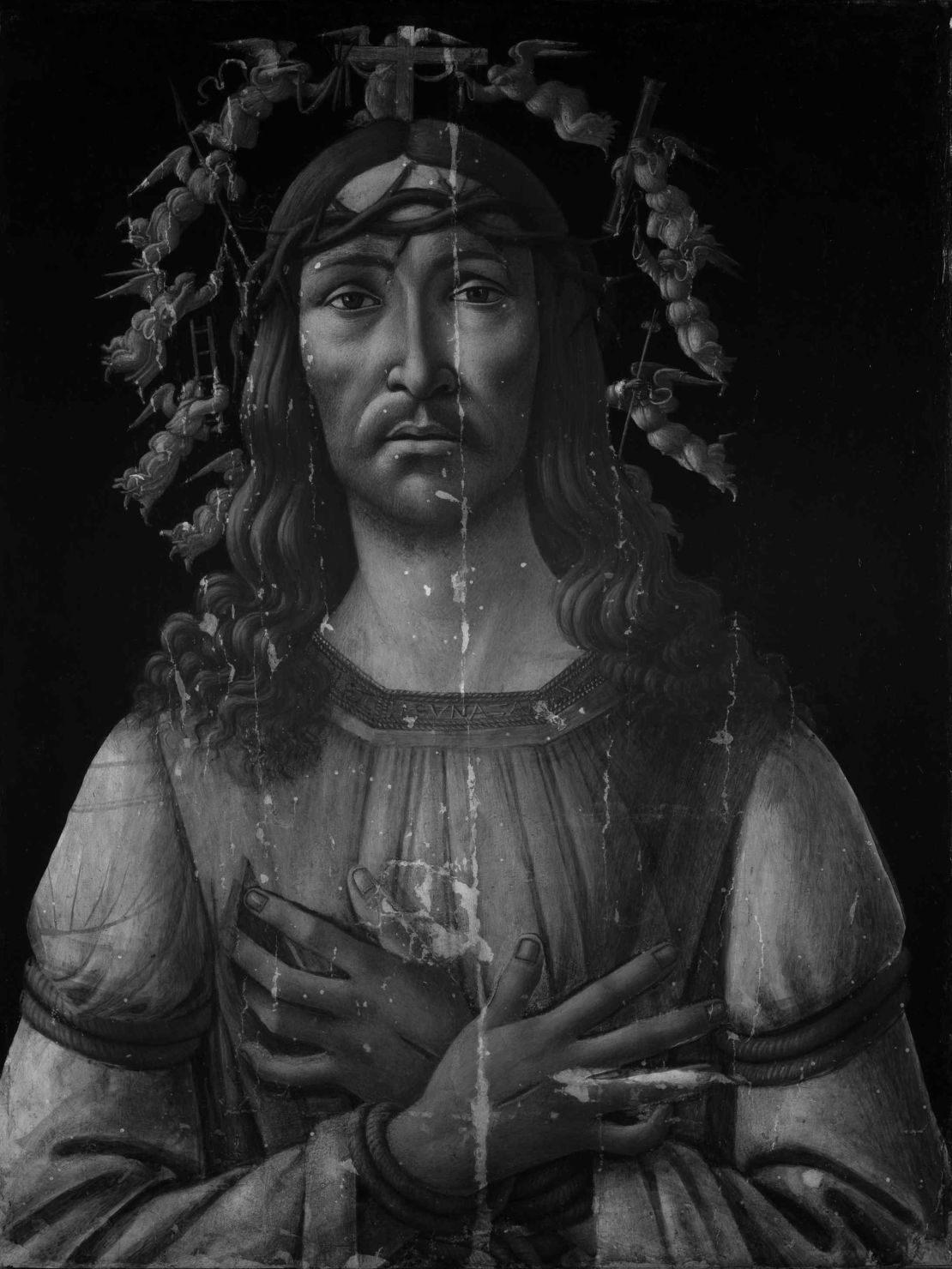 An infrared image of "Man of Sorrows," reveals the faint outline of a Madonna and Child underneath.