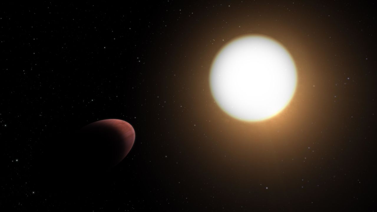 This artist's impression shows the football-shaped planet WASP-103b (left) closely orbiting its host star.