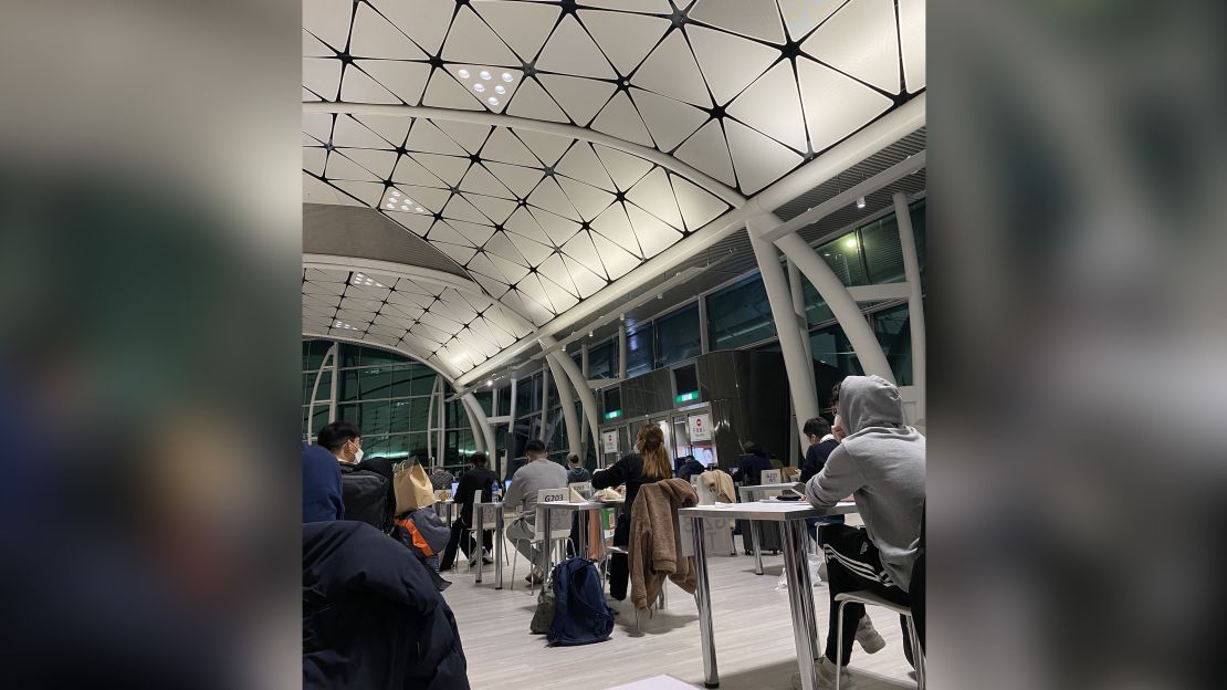 Travelers wait for Covid-19 test results at Hong Kong International Airport.