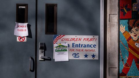 A "school closed" sign hangs at an entrance to the Pulaski International School of Chicago after classes were canceled.
