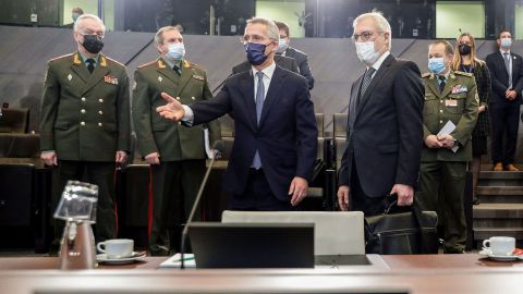Russian Deputy Foreign Minister Alexander Grushko, right, and NATO Secretary General Jens Stoltenberg, center, arrive at the NATO-Russia Council at the Alliance's headquarters in Brussels, on January 12, 2022. 