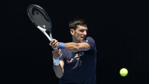 MELBOURNE, AUSTRALIA - JANUARY 12: Novak Djokovic of Serbia plays a backhand shot during a practice session ahead of the 2022 Australian Open at Melbourne Park on January 12, 2022 in Melbourne, Australia. (Photo by Darrian Traynor/Getty Images)