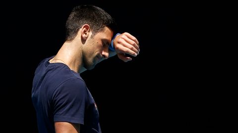 Djokovic wipes his forehead during a practice session on Wednesday,  January 12.