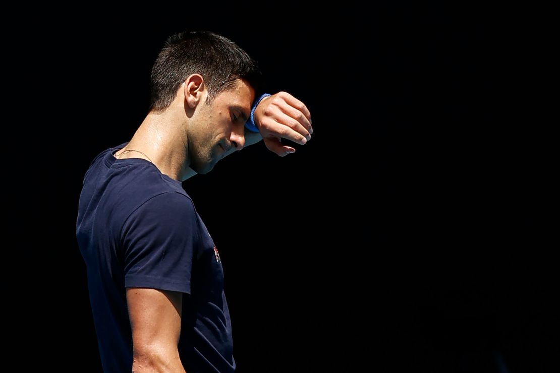 Djokovic wipes his forehead during a practice session on Wednesday,  January 12.