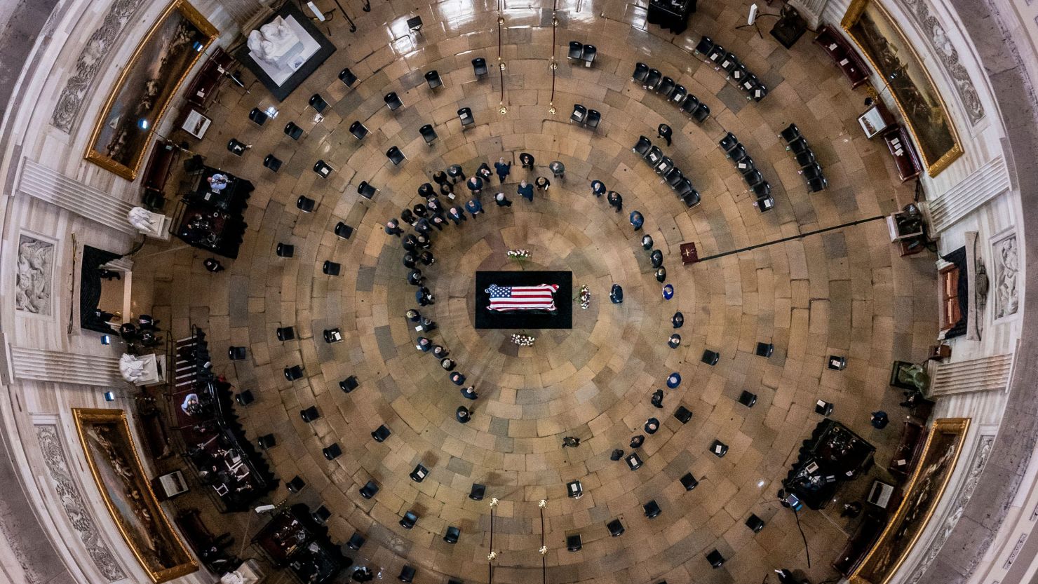 Members of Congress surround the casket of former Senate Majority Leader Harry Reid of Nevada as he lies in state in the Rotunda of the US Capitol on Wednesday.
