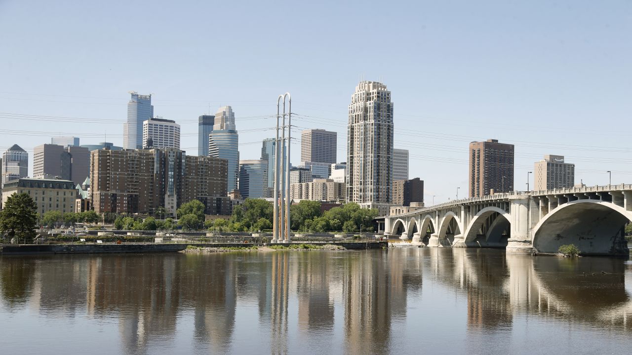 The Minneapolis skyline is shown Thursday, July 11, 2019, behind the Mississippi River. (AP Photo/Jim Mone)