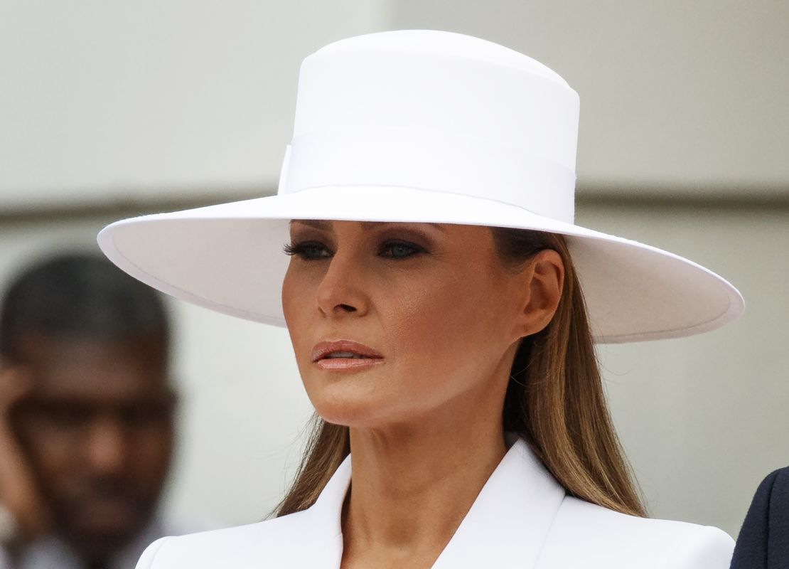 Then-first lady Melania Trump waits with then-President Donald Trump to greet French President Emmanuel Macron and his wife Brigitte Macron during a State Arrival Ceremony on the South Lawn of the White House in 2018.