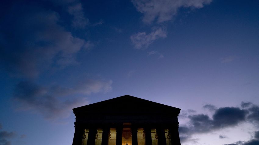 Clouds are seen in the sky above the US Supreme Court at dusk in Washington, DC on January 11, 2022.