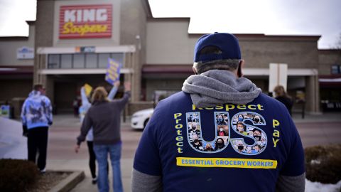 Johnny Martinez, front, and members of United Food and Commercial Workers Local 7 strike against King Soopers in front of the supermarket in Village Center in Highlands Ranch, Colorado on Wednesday, January 12.