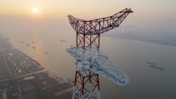 Workers assemble the 385-meter-tall transmission tower by the side of Yangtze River on January 12 in Taizhou, Jiangsu Province of China. The 500-kilovolt power tower became the world's tallest transmission tower. 