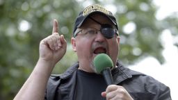 In this Sunday, June 25, 2017 file photo, Stewart Rhodes, founder of the citizen militia group known as the Oath Keepers speaks during a rally outside the White House in Washington.