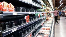 Shelves that held ham products are partially empty at a grocery in Fairfax, Virginia, on January 13.
