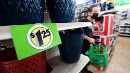 A sign displaying $1.25 price is posted on the shelves of a Dollar Tree store in Alhambra, California, December 10, 2021.